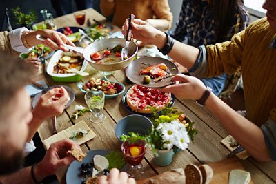 People share food around the table