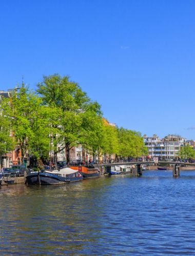 Panorama View Of Houses Near Canals In Amsterdam